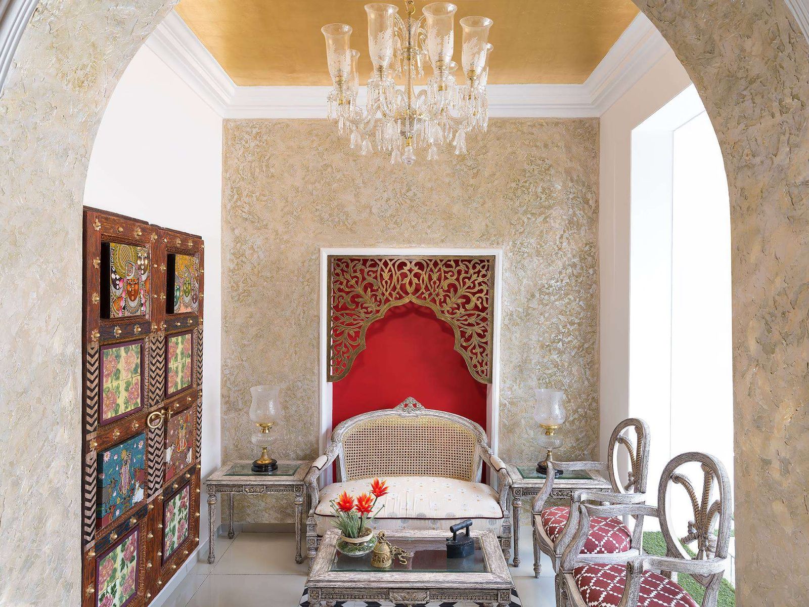 A gold-leaf lounge with crystal chandelier inside Amiraah